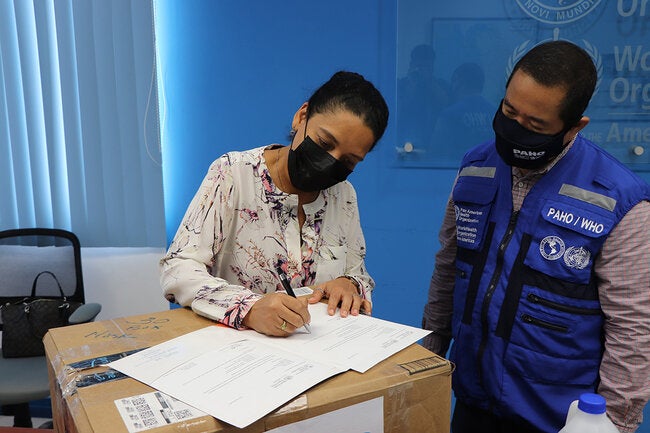 BCVI rep signing the handover documents