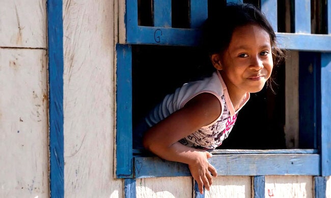 Child looking through the window