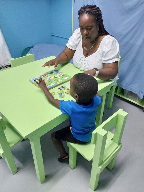 Child works with therapist