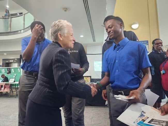 Hon. Glennys Hanna-Martin greets students during the Ministry of Education, Technology, and Vocational Training's inaugural mental health expo for students.  