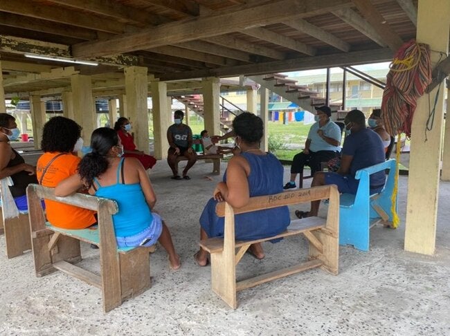 Photo of people sitting on a classroom taking a training