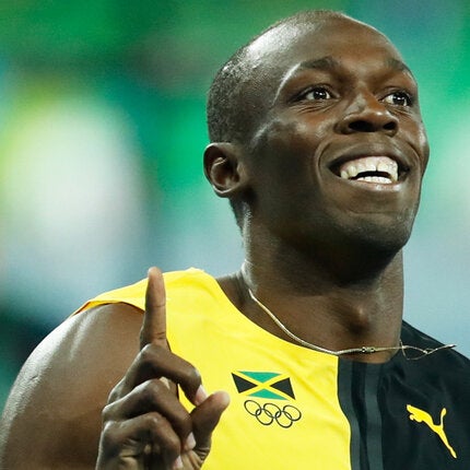 Usain Bolt running wearing Jamaica jersey
