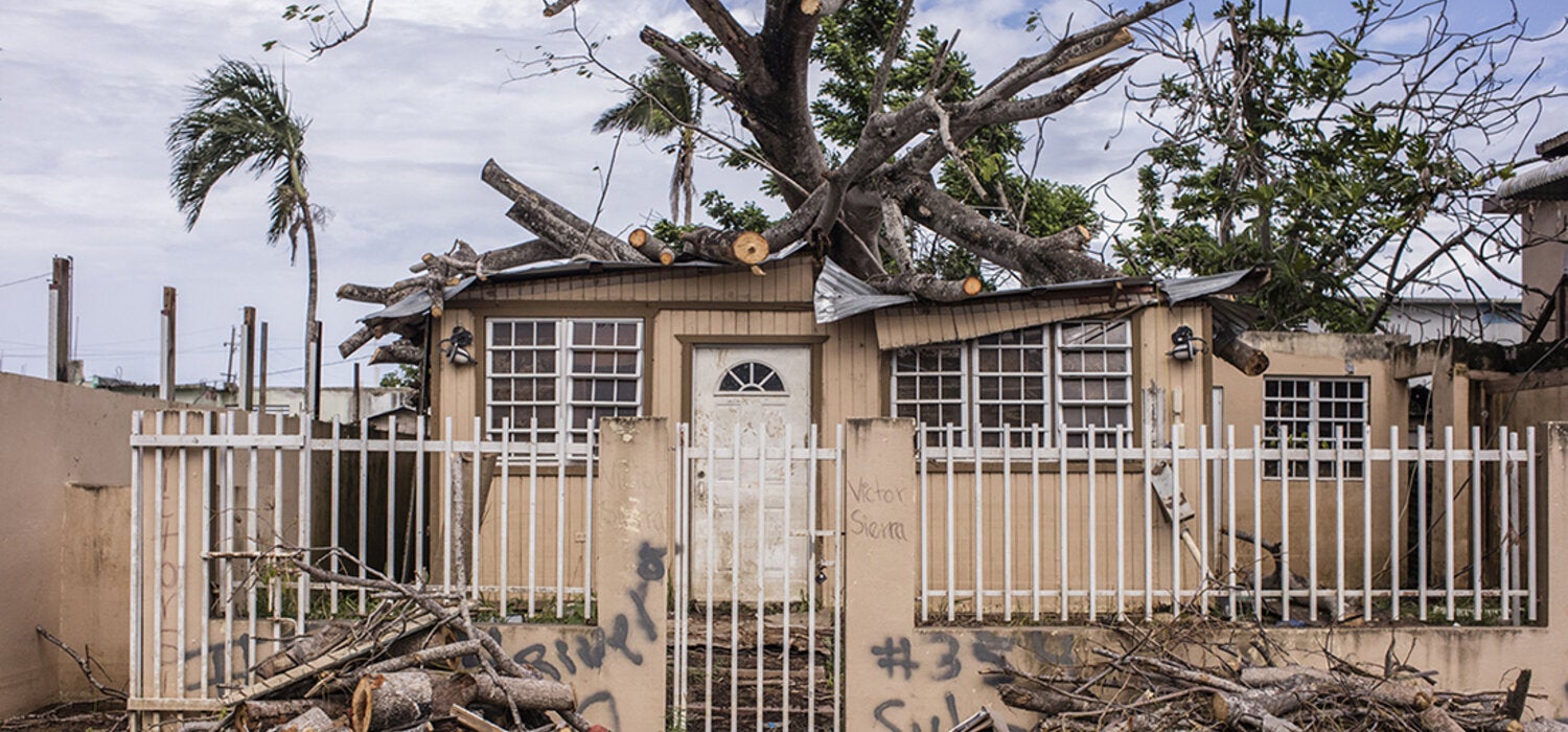 Debris outside house after storm in Puerto Rico