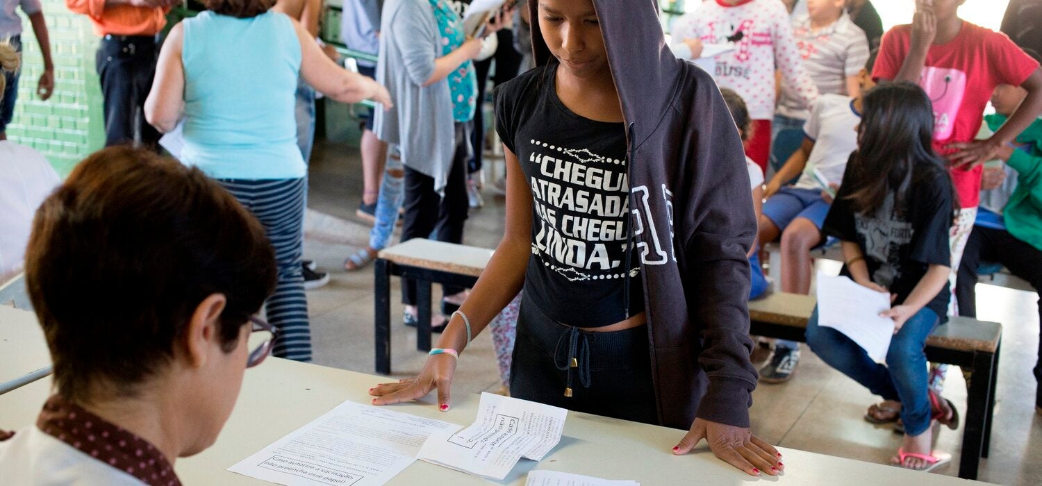 A teenager registers to receive the HPV vaccine