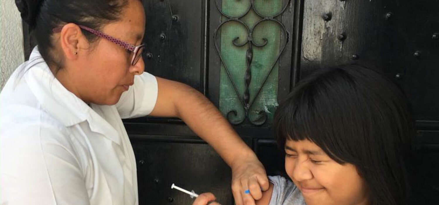 Girl being vaccinated