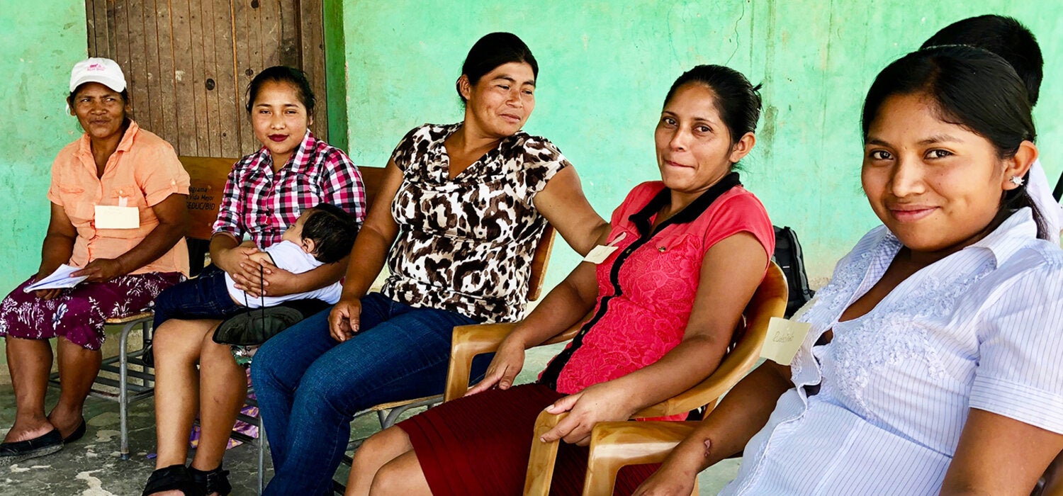 Group of women sitting outdoors