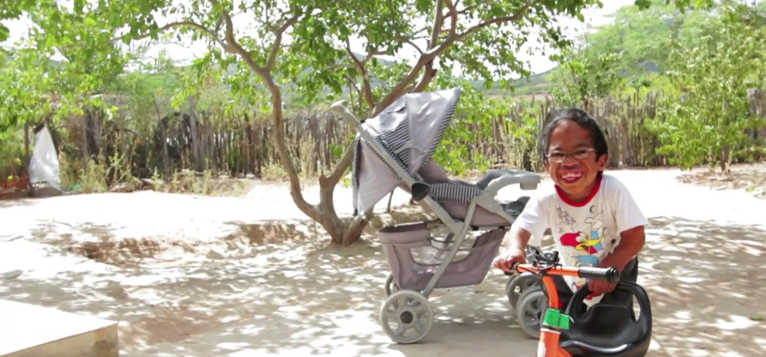 Happy child playing in courtyard