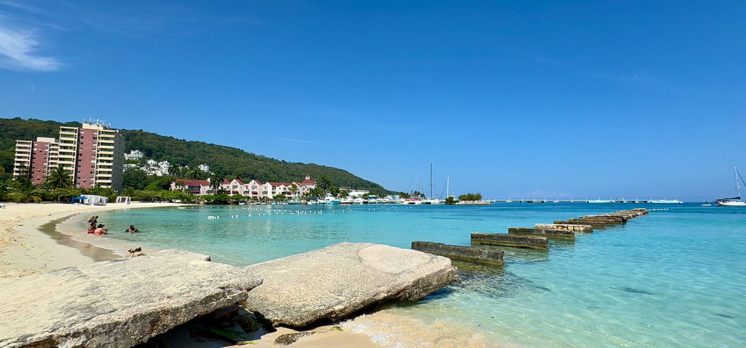 Beautiful blue ocean and white sand Jamaican beach.