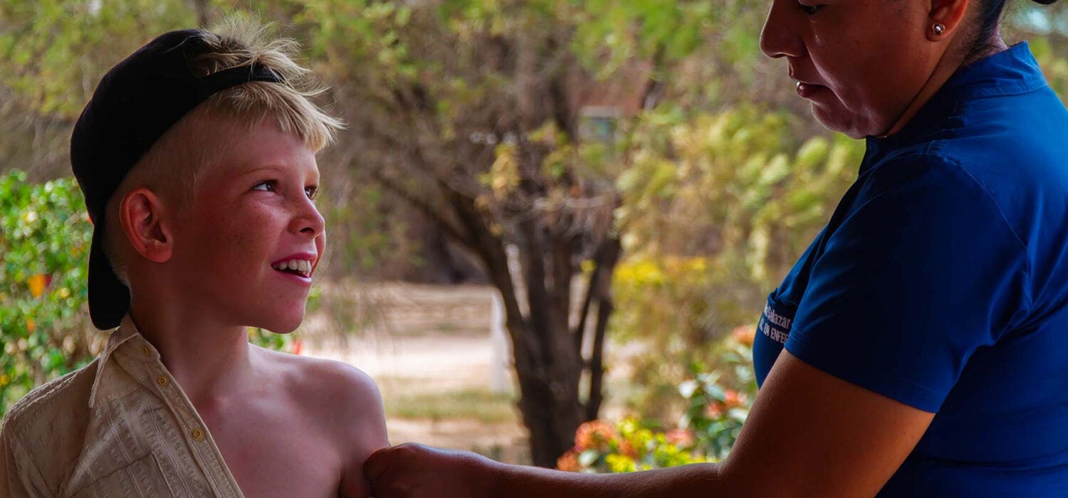 menonite boy recieves vaccination