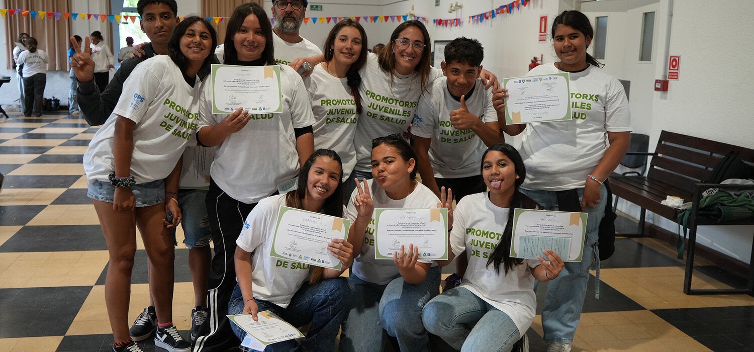 Young participants group photo holding up certificates