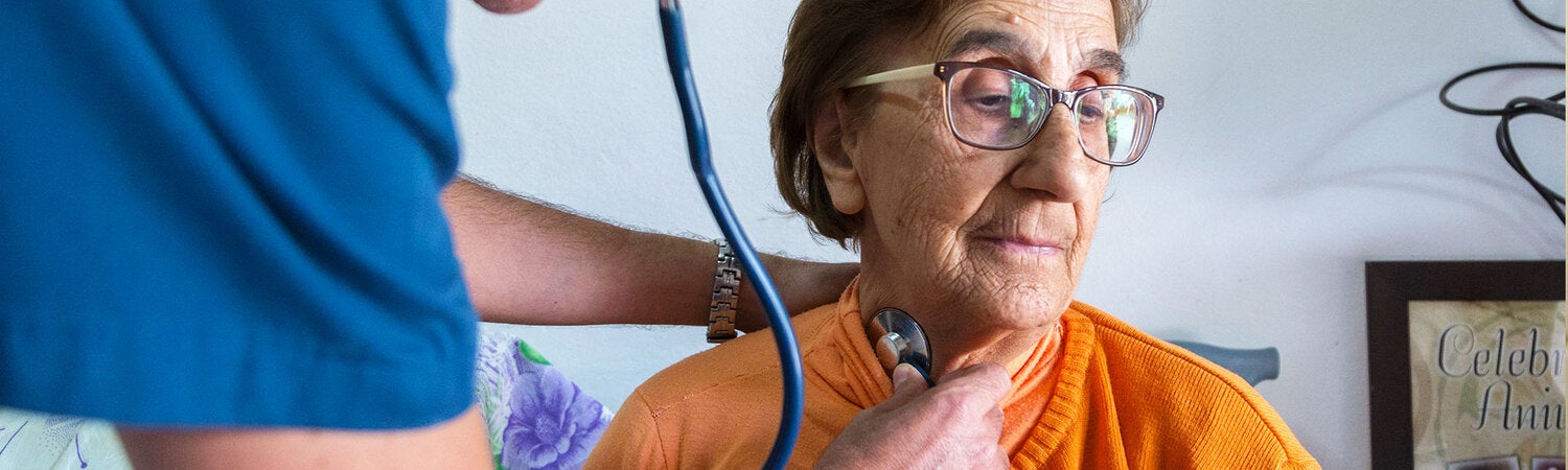 Provider checking patients heart 