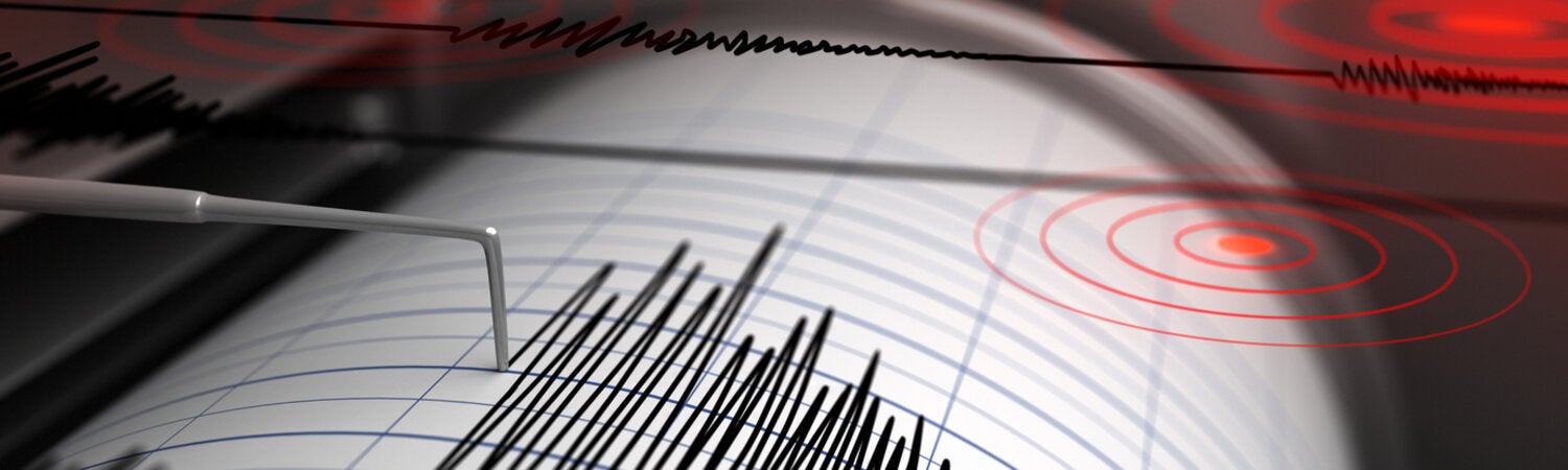 Seismograph with paper in action and earthquake