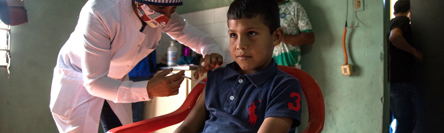 Boy gets vaccine