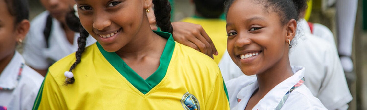 Two Caribbean young ladies smiling 