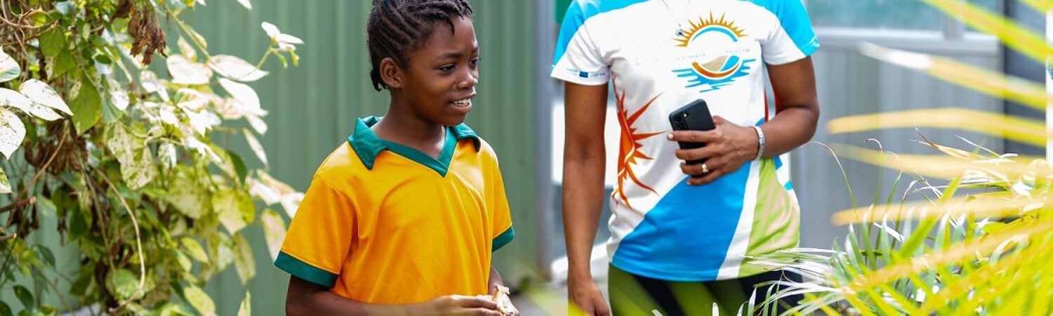 A young girl and a woman in a garden