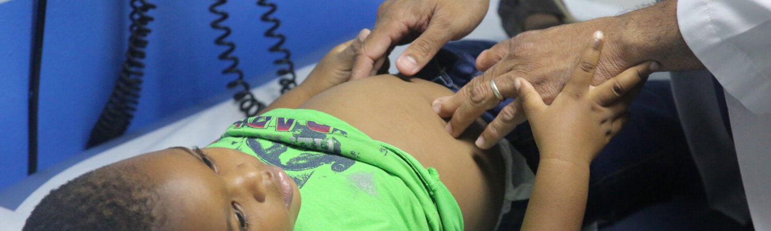 Boy being treated at Matron Roberts clinic