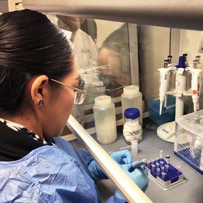 Woman in laboratory performing molecular test