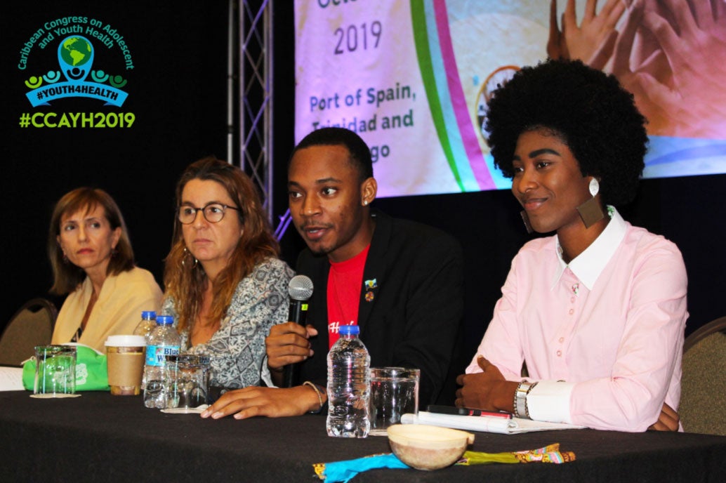 Youth advocates Dennis Glasgow from Guyana and Christina Williams from Jamaica participate in panel discussions at the Congress